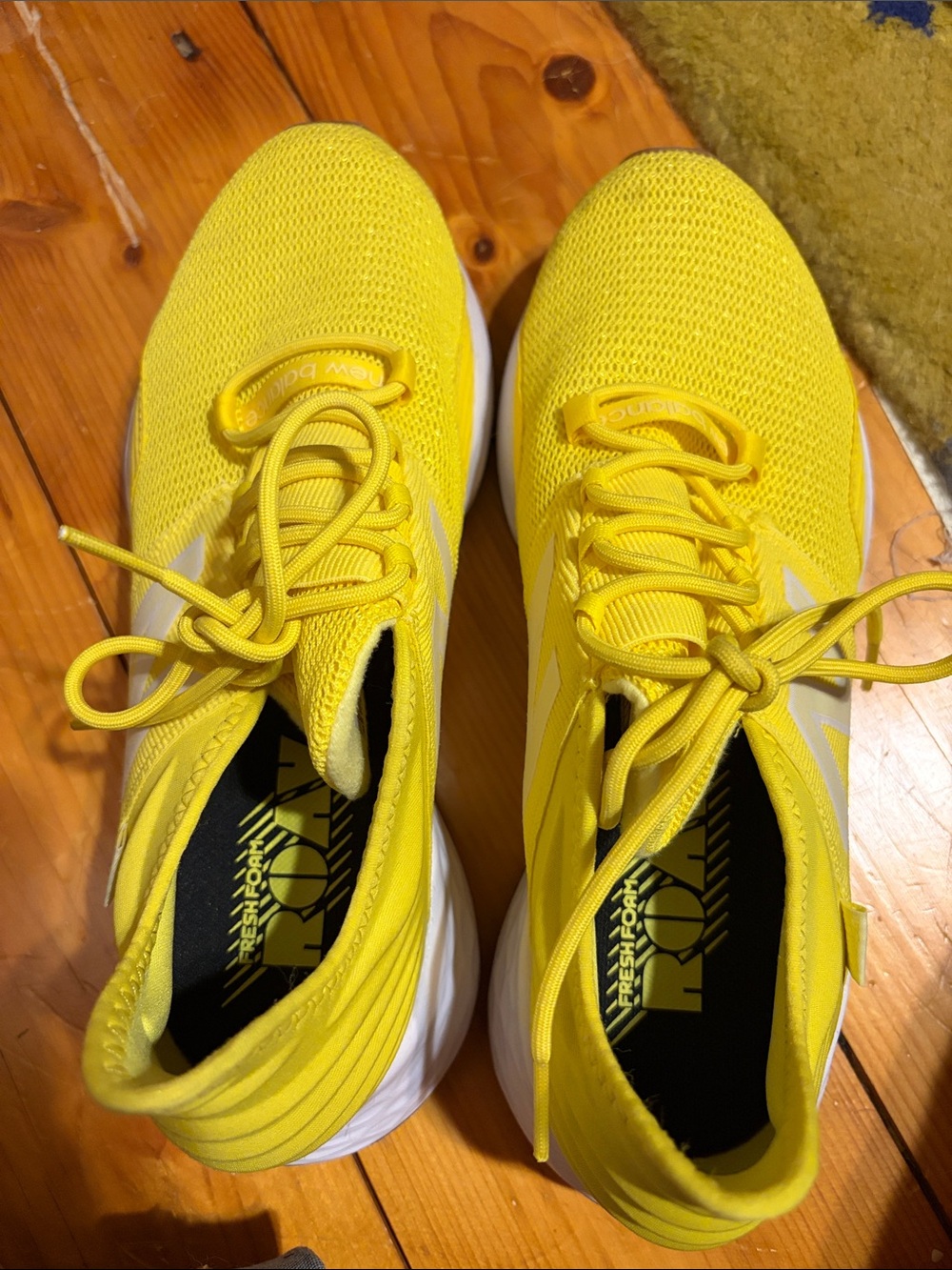 Woman’s yellow new balance sneaker